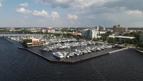 aerial view of bradenton marina with boats docked and the city skyline over the manatee river