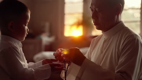intergenerational spiritual guidance: an elder teaches a child about prayer beads