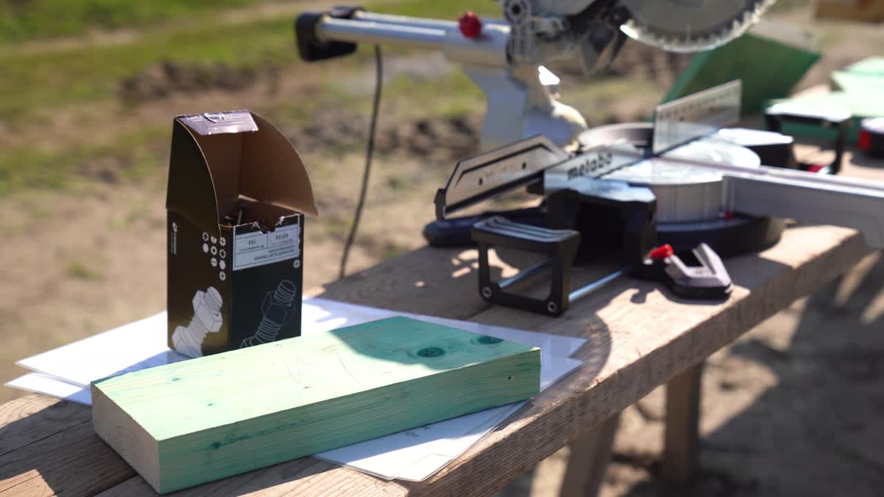 Circular saw placed on bench at outdoor woodworking site