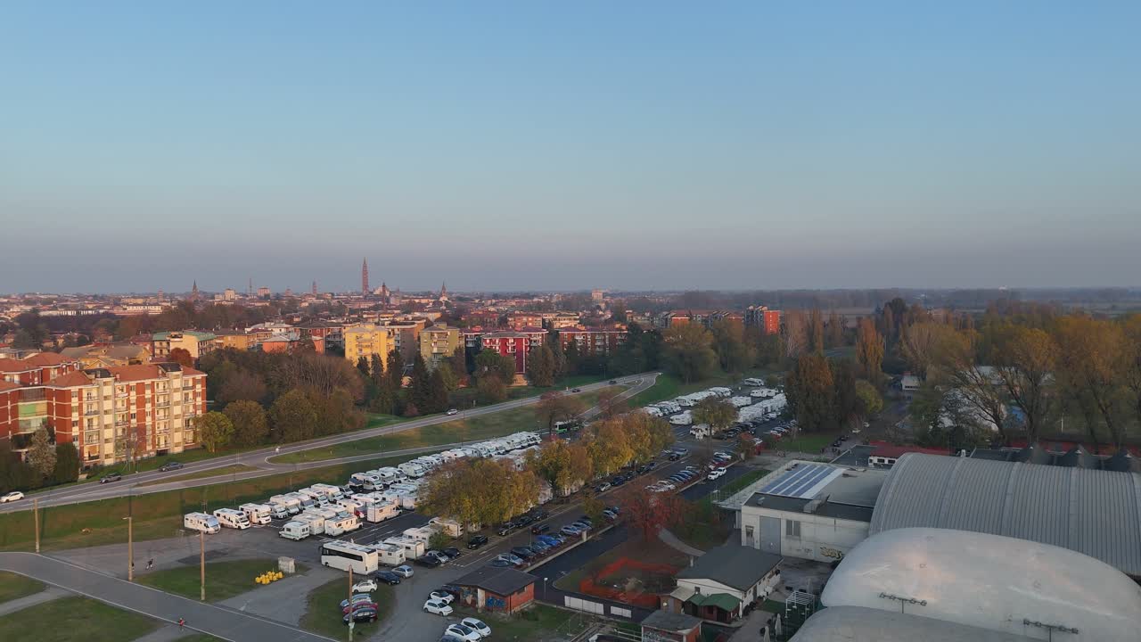 Aerial view highlighting numerous RVs and campers parked at the dedicated facility in Piazzale Azzurri d'Italia, Cremona