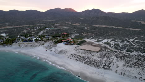 drone shot in rotational view of the hotels near the beach in ensenada de los muertos, baja california sur mexico