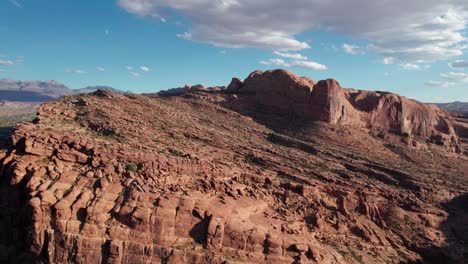 drone aerial view of a rocky mountain plateau in moab, utah