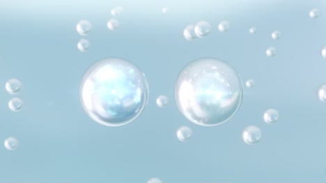 macro shot of various light blue bubbles in water rising up on light background.