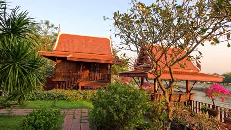 a serene view of a traditional thai house