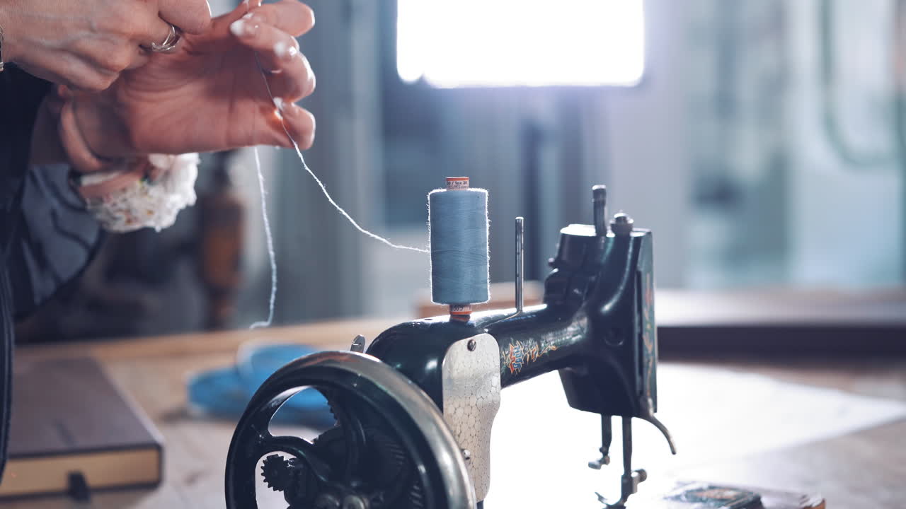 Old sewing machine. Close up of sewing machine and threads