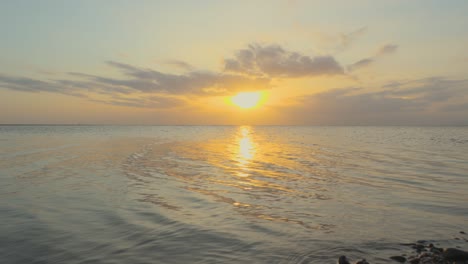 Tranquil-calm-sea-in-slow-motion-during-sunset-at-Fleetwood,-Lancashire,-UK