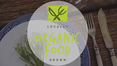 Locally grown organic food animation over table setting with plate and cutlery