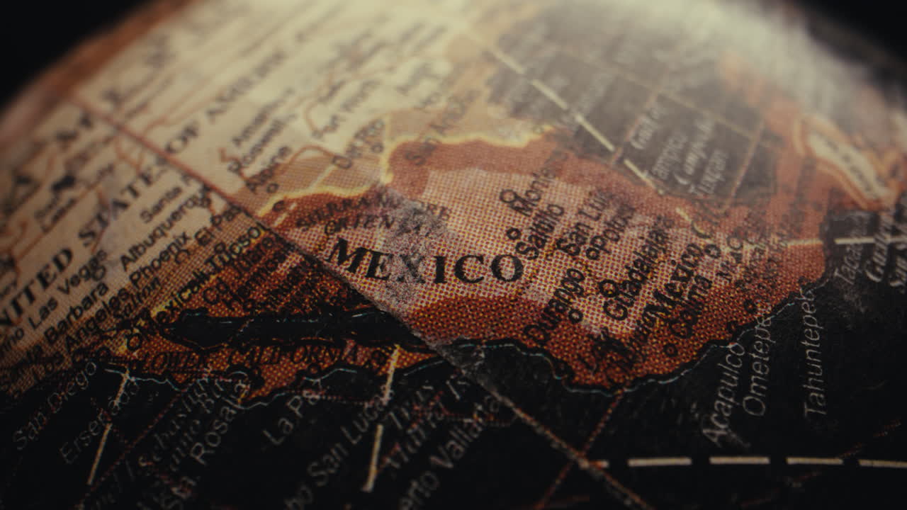 Close-up of a vintage world globe, focusing on the Mexico region