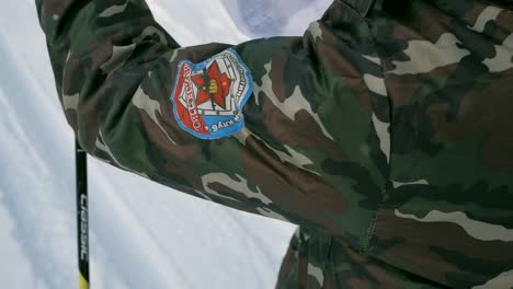 soldier using a map in snowy mountains