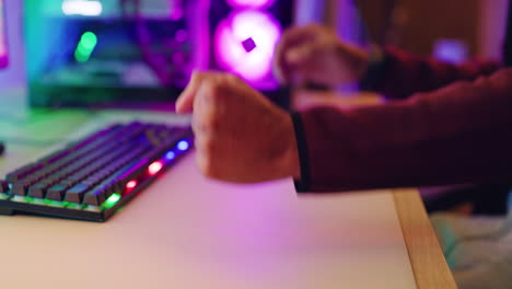 closeup of a frustrated gamer pressing