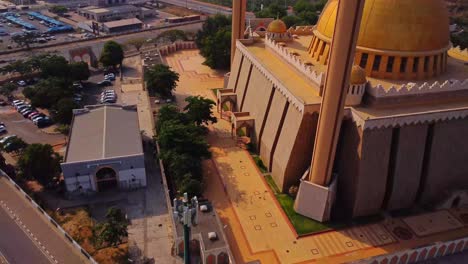 drone flying away from the entrance of the abuja national mosque in nigeria, africa