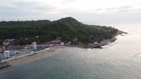 Aerial-footage-of-an-island-with-a-swimming-pool-resort-in-the-Philippines