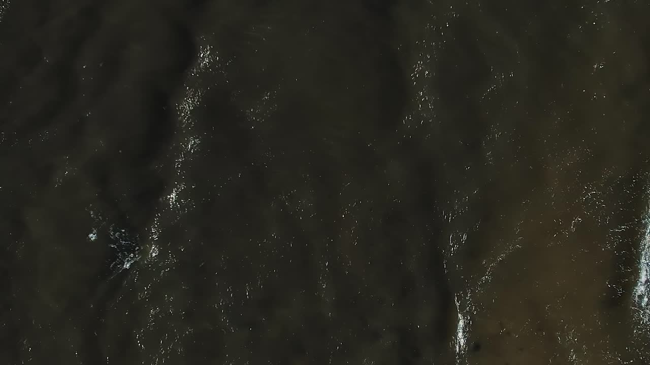 Waves rolling in on the Baltic Sea during a cloudy day