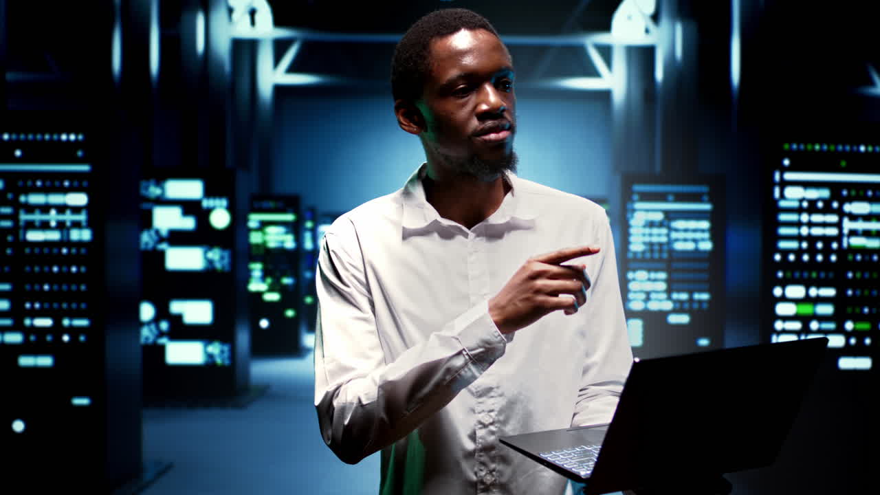 Engineer walking between supercomputers