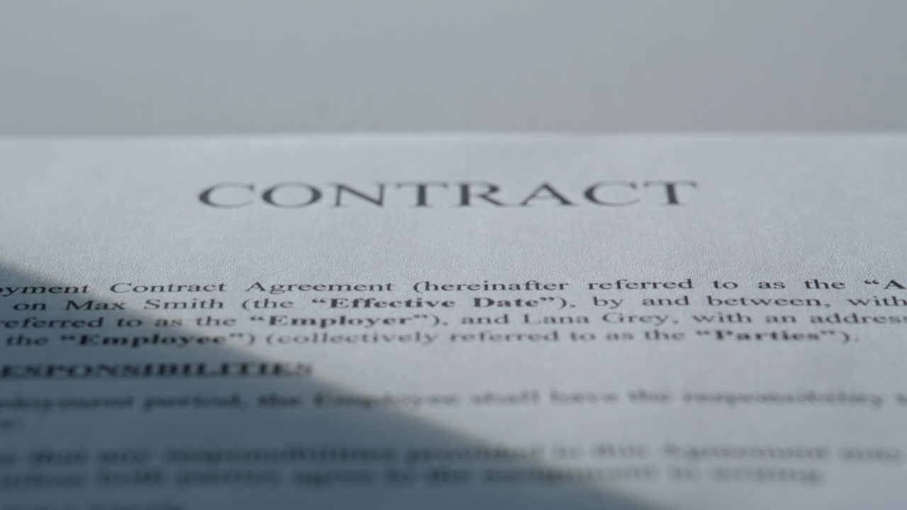 Closeup paper contract text under sun rays in office table. Business document