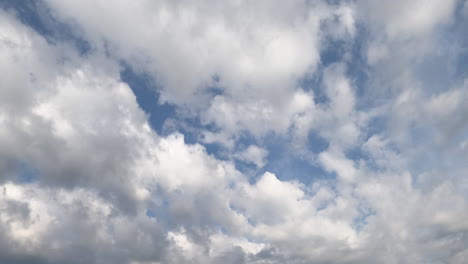 white soft cloudscape accumulating in the atmosphere. rainy clouds gathering in the sky. timelapse.