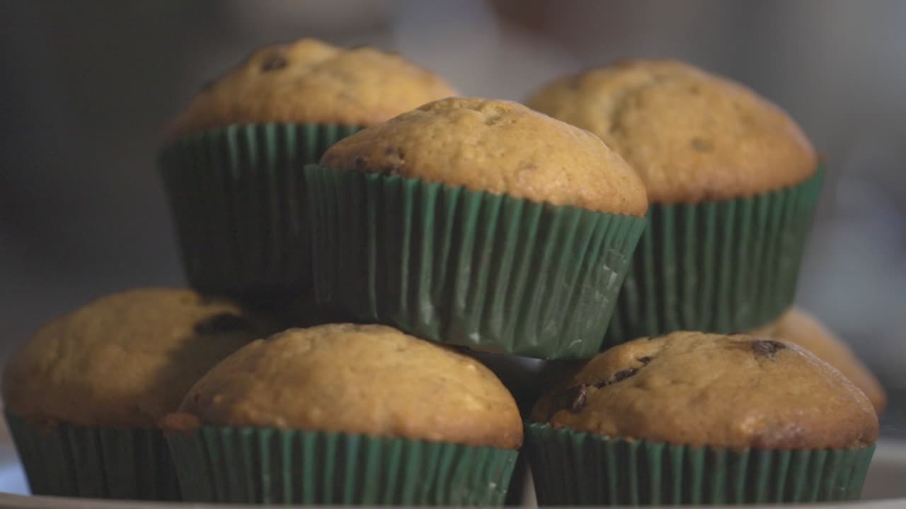 Delicious And Tasty Chocolate Chip Muffin. Rotating In Slow Motion. - close up shot