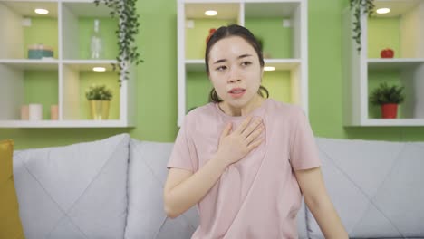 young asian woman with copd has long-term shortness of breath, can't breathe.