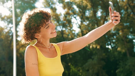 woman taking a selfie in a park