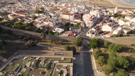 Aerial-depicting-the-historic-wall-surrounding-the-coastal-city-of-Lagos-in-Portugal