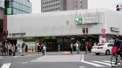tokyo, japan - 8th oct. 2018 : jr, metro, yoyogi station, 4k, camera zoom, angle neutral.people and traffic at the entrance of the station. west exit yoyogi station.