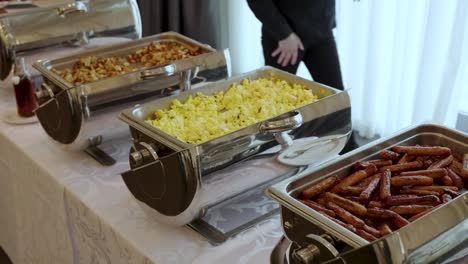 potatoes, eggs and sausage being served for breakfast at a restaurant