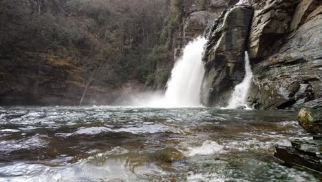 linville falls water spashing in foreground in snow