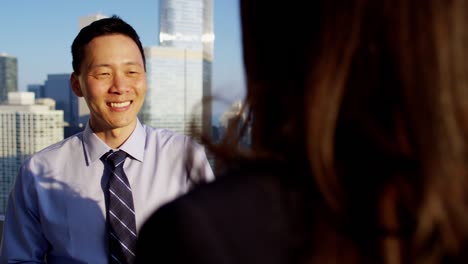 multi ethnic team managers discussing markets overlooking chicago