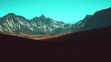 stunning mountain range under a clear blue sky during daylight hours