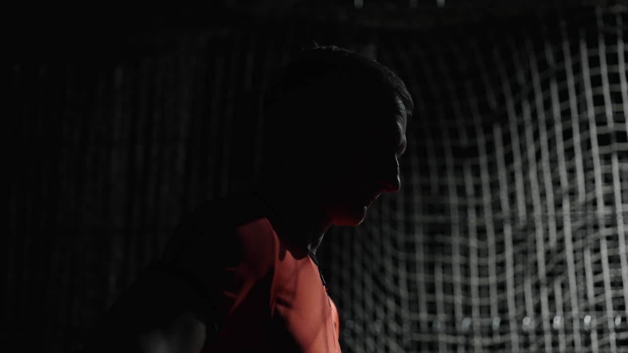 Silhouette of a Person in a Dark Indoor Setting