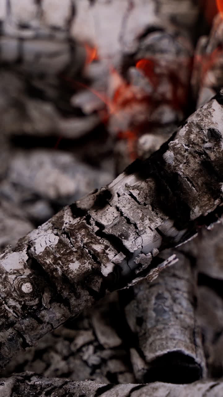 Wooden embers beautifully glowing. Close up of wood burning in the fireplace