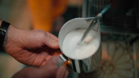 Barista-steaming-milk-for-coffee