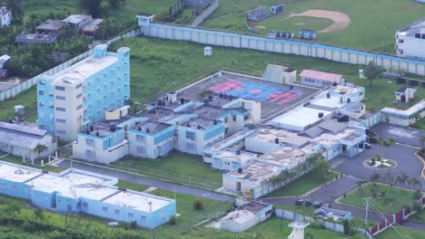 aerial shot of najayo prison with old buildings and blocks in san cristobal, dominican republic