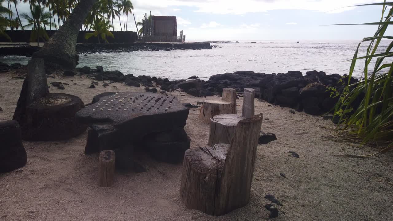 Gimbal wide panning shot of the ancient Hawaiian kōnane board game in Pu'uhonua O Honaunau Historical Park, Hawai'i