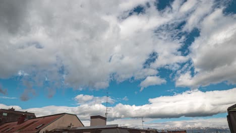 Time-lapse-footage-of-large-menacing-cumulus-storm-clouds-forming-against-a-blue-sky-background-indicating-impending-bad-weather