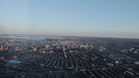 boston skyline during golden hour from the top of a sky scraper viewing deck in 4k