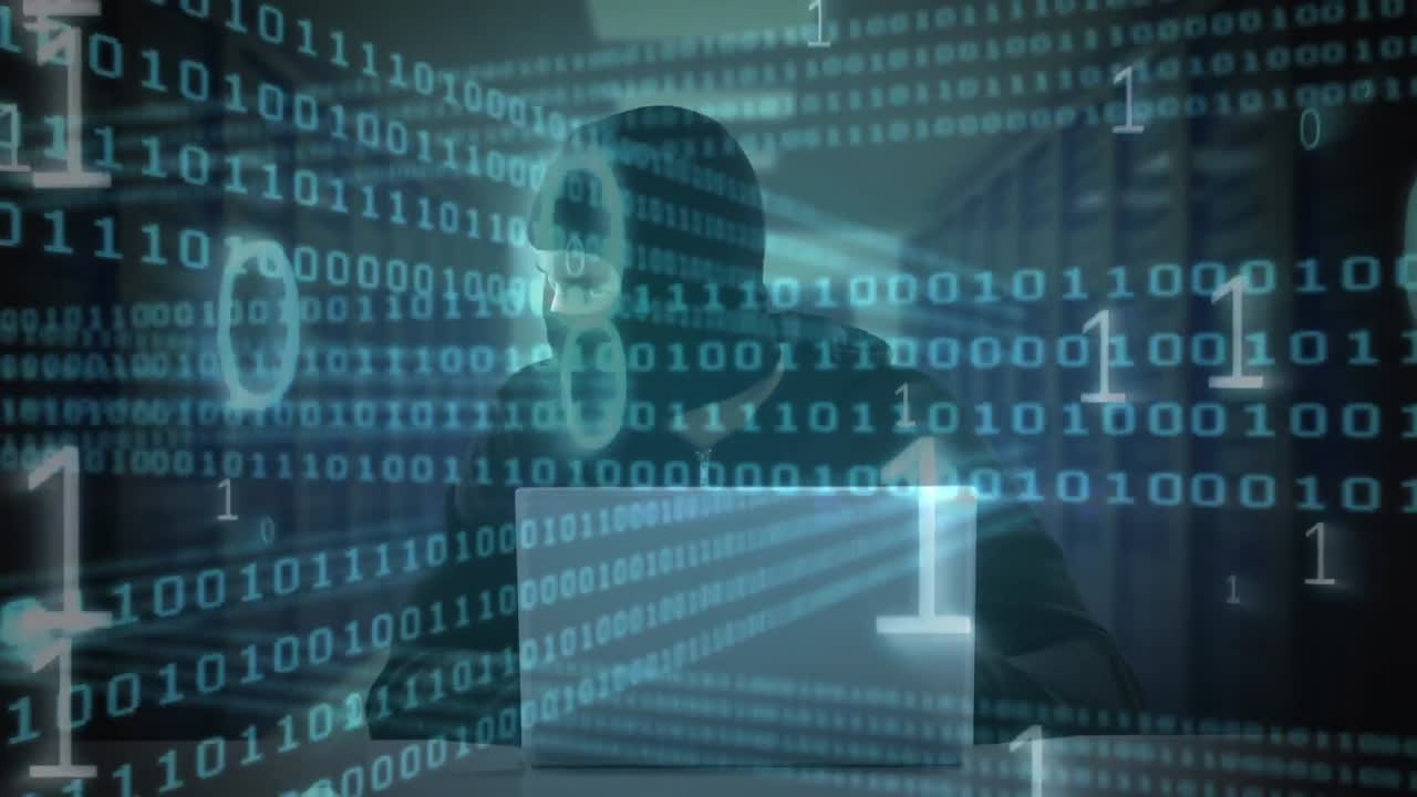Animation of binary coding processing and masked hacker using laptop in dark room