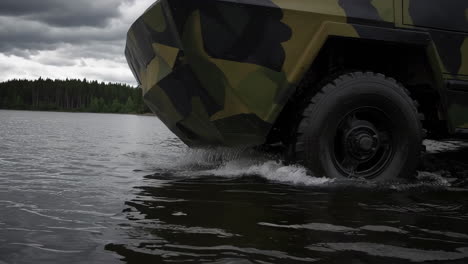 military vehicle crossing a lake