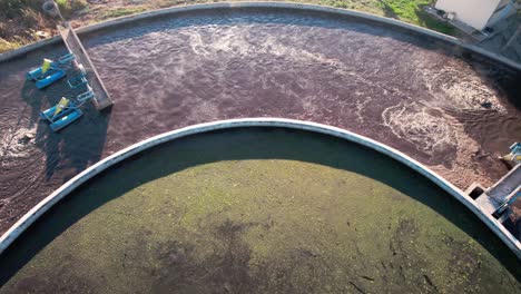 drone shot of water purification plant, reservoir station with sewerage water, revealing high angle shot