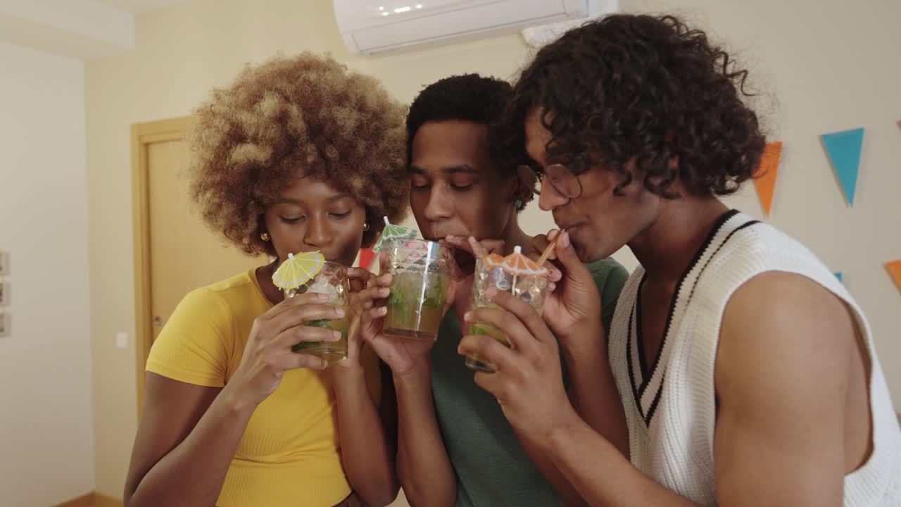 Friends celebrating with cocktails at a party