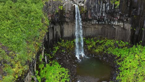 Svartifoss-Waterfall-In-Vatnajokull-National-Park,-Iceland---aerial-drone-shot