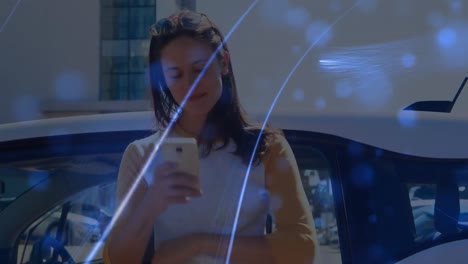 Animation-of-network-of-connections-over-woman-using-phone-on-the-beach