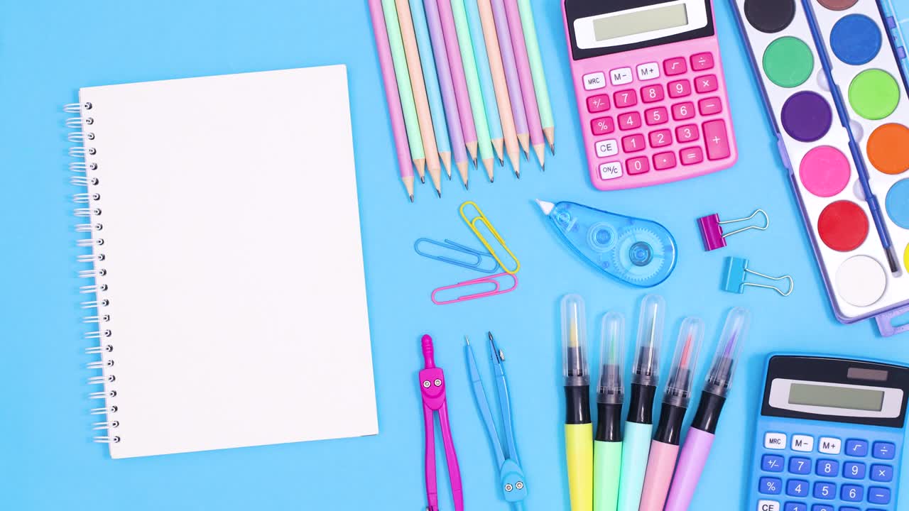 School accessories move on pastel blue theme with empty open notebook for text. Stop motion