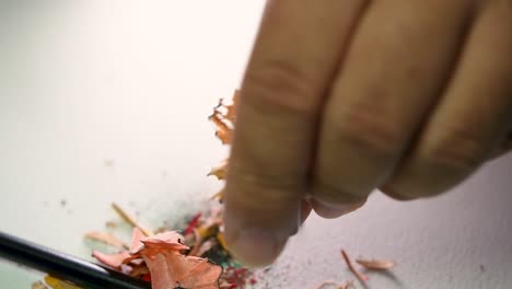 Footage-of-hands-slowly-sharpening-a-pencil-and-some-coloured-pencils-with-a-Wedge-Pencil-Sharpener