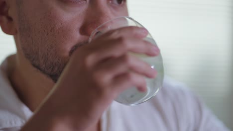 man drinking a drink