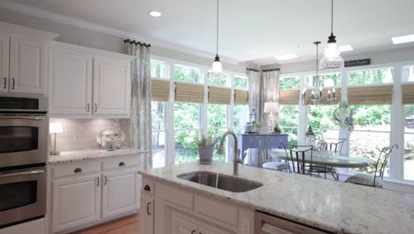 luxury, bright kitchen in modern style large windows onto the garden