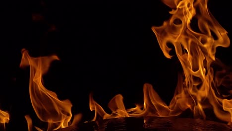 Flames-of-fire-on-black-background-in-slow-motion