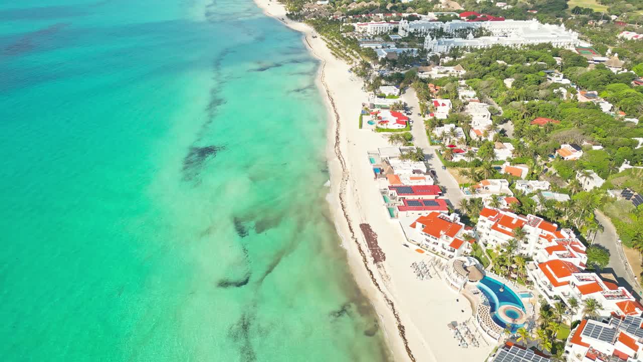 Playa del carmen beach with turquoise water and tropical resorts, aerial view