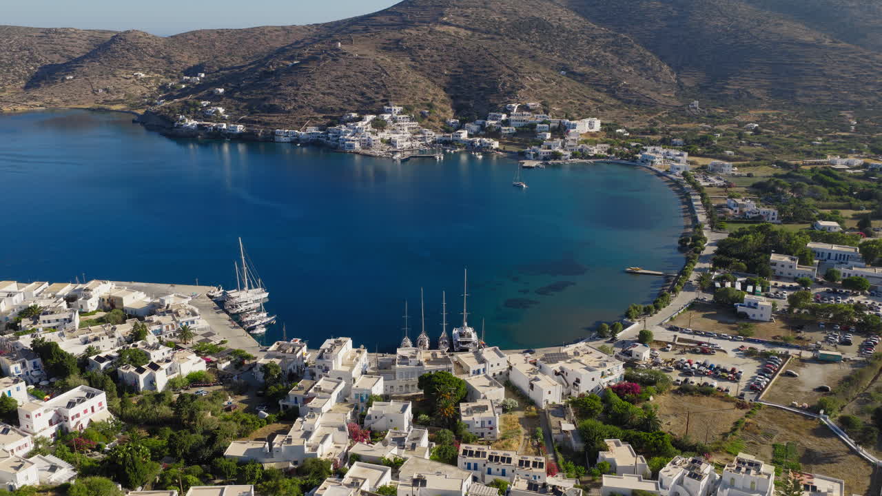 Katapola port village on Amorgos island, establishing drone shot