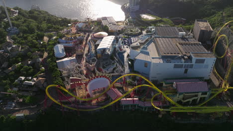 Orbiting-shot-of-Hong-Kong-Ocean-Park-amusement-park-during-golden-hour